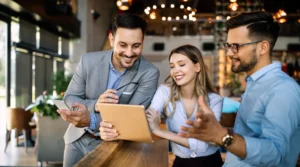Team collaborating with an accounting firm workflow software on a tablet to streamline financial processes, communication, and client management