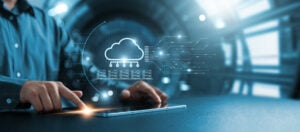 Businessman using tablet to transfer data on cloud computing, seamless data transfer and strong internet security, server based communication on social networks, servers and storage.